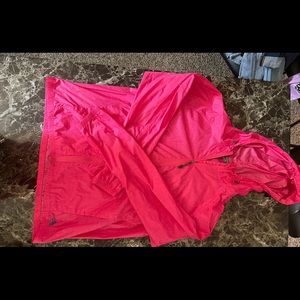 Pink Nike ACG lightweight jacket.